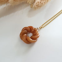 Translucent Brilliant Orange Jadeite “Eternity Knot” Pendant (JAB004994) 1